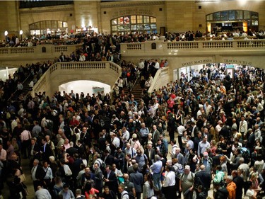 NEW YORK, NY - MAY 15:  Commuters wait for train service to be restored after a severe thunderstorm downed trees that caused power outages resulting in several Metro-North lines being suspended at Grand Central Terminal on May 15, 2018 in New York City. A powerful storm swept through the region just as the evening commute was kicking off after 5 p.m.
