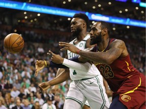LeBron James #23 of the Cleveland Cavaliers battles for the ball against Jaylen Brown #7 of the Boston Celtics in the first half during Game Two of the 2018 NBA Eastern Conference Finals at TD Garden on May 15, 2018 in Boston, Massachusetts.