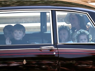 WINDSOR, UNITED KINGDOM - MAY 19:  Catherine, Duchess of Cambridge arrives with page boys Prince George (L) and Jasper Dyer and bridesmaids Princess Charlotte (R) and Florence van Cutsem at St George's Chapel at Windsor Castle for the wedding of Prince Harry and Meghan Markle on May 19, 2018 in Windsor, England.
