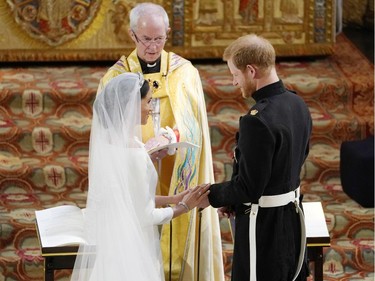 WINDSOR, UNITED KINGDOM - MAY 19:  Prince Harry and Meghan Markle exchange vows during their wedding ceremony in St George's Chapel at Windsor Castle on May 19, 2018 in Windsor, England.