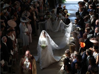 Meghan Markle walks down the aisle as she arrives at St George's Chapel at Windsor Castle for her wedding to Prince Harry on May 19, 2018 in Windsor, England.