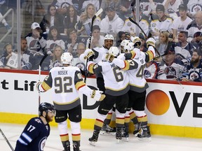 Ryan Reaves #75 of the Vegas Golden Knights celebrates with teammates after scoring a second period goal against the Winnipeg Jets in Game Five of the Western Conference Finals during the 2018 NHL Stanley Cup Playoffs at Bell MTS Place on May 20, 2018 in Winnipeg.