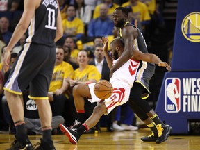 Chris Paul #3 of the Houston Rockets collides with Draymond Green #23 of the Golden State Warriors during Game Four of the Western Conference Finals of the 2018 NBA Playoffs at ORACLE Arena on May 22, 2018 in Oakland, California.