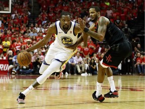 Kevin Durant #35 of the Golden State Warriors drives against Trevor Ariza #1 of the Houston Rockets in the third quarter of Game Seven of the Western Conference Finals of the 2018 NBA Playoffs at Toyota Center on May 28, 2018 in Houston, Texas.