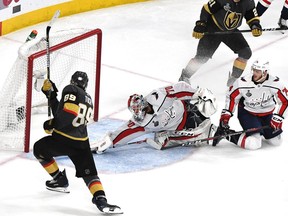 Braden Holtby #70 of the Washington Capitals makes a diving stick-save on Alex Tuch #89 of the Vegas Golden Knights during the third period in Game Two of the 2018 NHL Stanley Cup Final at T-Mobile Arena on May 30, 2018 in Las Vegas, Nevada.
