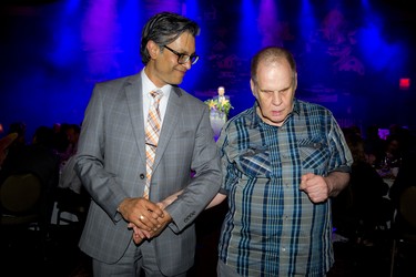 Adrian Raghunandan with John Robson after Robson won over the crowd with a speech about his personal connection to Citizen Advocacy Ottawa.