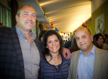 Former Canadian rugby union footballer, Al Charron, along with his wife Annette Charron and Dan Saikaley, a portfolio manager with CIBC.