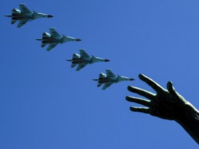 FILE: Russian Sukhoi Su-34 fighter-bombers fly over Red Square during the Victory Day military parade in Moscow on May 9, 2018. Russia marks the 73rd anniversary of the Soviet Union's victory over Nazi Germany in World War Two.