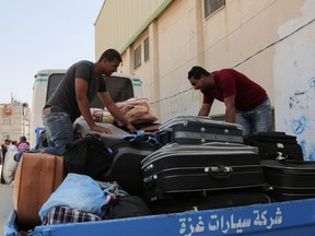 Palestinians wait to travel to Egypt through the Rafah border crossing, in the southern Gaza Strip, on May 18, 2018. Egyptian President Abdel Fattah al-Sisi has made a rare decision to open the Rafah crossing with Gaza for a month, allowing Palestinians to cross during the holy period of Ramadan. The decision to keep the crossing open was taken "to alleviate the suffering" of residents in the Palestinian enclave, Sisi said on Facebook late.