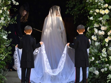 Meghan Markle arrives at St. George's Chapel wearing a dress by designer Clare Waight Keller.