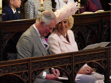 Britain's Prince Charles, Prince of Wales and Britain's Camilla, Duchess of Cornwall wait in the chapel for the wedding ceremony of Britain's Prince Harry, Duke of Sussex and US actress Meghan Markle in St George's Chapel, Windsor Castle, in Windsor, on May 19, 2018.