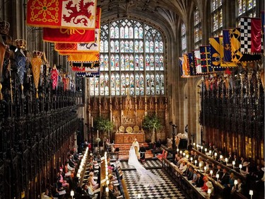 US fiancee of Britain's Prince Harry Meghan Markle and Britain's Prince Harry, Duke of Sussex during their wedding ceremony conducted by the Archbishop of Canterbury Justin Welby in St George's Chapel, Windsor Castle, in Windsor, on May 19, 2018.