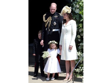 Britain's Prince William, Duke of Cambridge and Britain's Catherine, Duchess of Cambridge leave with their children Prince George and Princess Charlotte after attending the wedding ceremony of Britain's Prince Harry, Duke of Sussex and US actress Meghan Markle at St George's Chapel, Windsor Castle, in Windsor, on May 19, 2018.