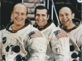 (FILES) Picture taken November 1969 of US Astronauts of the Apollo XII (L-R) Mission Commander Charles "Pete" Conrad, Jr.; Command Module Pilot Richard F. Gordon and Lunar Module Pilot Alan L. Bean, pause in front of stairway leading to their mission simulator at the Kennedy Space Center.  Bean, the fourth person to walk on the moon, has died, his family announced in a statement released by NASA. He was 86 years old. The moonwalker who went on to become a painter died on May 26, 2018, in Houston after suddenly falling ill weeks before, the statement said.