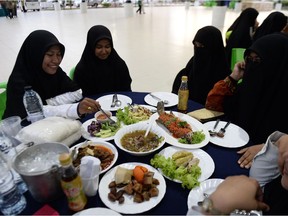 Muslim students wait to break fast during their holy month of Ramadan in narathiwat on May 30, 2018. Muslims throughout the world are marking the month of Ramadan during which Muslim devotees fast from dawn until dusk.