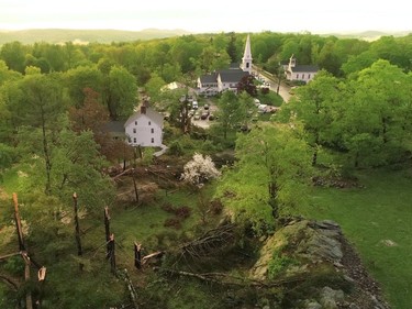 This aerial view shows storm damage to Brookfield, Conn., on Tuesday, May 15, 2018. Residents in the Northeast cleaned up Wednesday, a day after powerful storms pounded the region with torrential rain and marble-sized hail, leaving more then 200,000 homes and businesses without power.  (John Woike/Hartford Courant via AP) ORG XMIT: CTHAR103