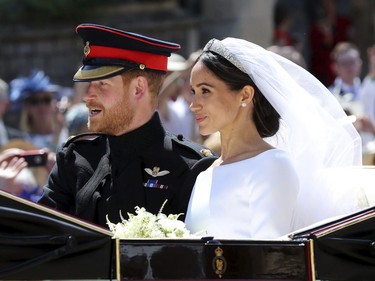 Meghan Markle and Prince Harry leav after their wedding at St. George's Chapel in Windsor Castle in Windsor, near London, England, Saturday, May 19, 2018.