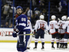 Tampa Bay Lightning right wing Nikita Kucherov leaves the ice as the Washington Capitals celebrate their 6-2 win during Game 2. (AP Photo/Chris O'Meara)