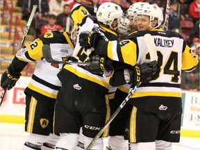 Hamilton Bulldogs Connor Walters and Arthur Kaliyev celebrate team's first goal against Soo Greyhounds goalie Matthew Villalta during first-period action of Game 5 of Ontario Hockey League championship series at Essar Centre in Sault Ste. Marie, Ont., on Friday, May 11, 2018.