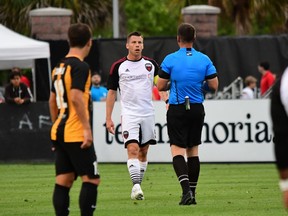Carl Haworth of Ottawa Fury FC talks with referee Kevin Broadley during Saturday's game against the host Charleston Battery. The match ended in a 0-0 draw. Charleston Battery photo