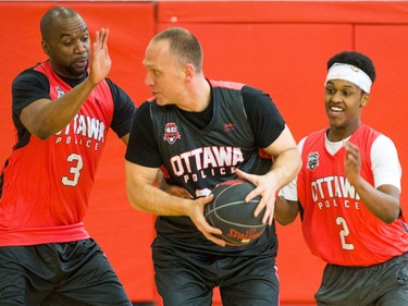 Ibrahim (R) moves in with Chabine Tucker (L) on Mark Neilson (C).