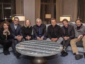 This undated image released by Netflix shows director Martin Scorsese, center, with the cast of the Canadian sketch comedy show "SCTV" from left, Andrea Martin, Eugene Levy, Catherine O'Hara, Dave Thomas, Martin Short and Joe Flaherty.