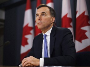 Finance Minister Bill Morneau speaks about the Trans Mountain Expansion project at a press conference in Ottawa on May 16, 2018. Finance Minister Bill Morneau will announce as early as Tuesday morning where the government plans to go with Kinder Morgan to ensure the controversial Trans Mountain pipeline expansion gets built.There are three options on the table, which include the government buying and building the expansion, then selling it once it's complete; and buying it on an interim basis, then selling it to investors and leaving them to handle the construction.