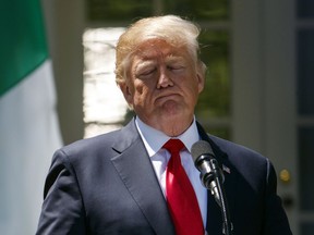 President Donald Trump pauses during a during a news conference with Nigerian President Muhammadu Buhari in the Rose Garden of the White House in Washington, Monday, April 30, 2018.