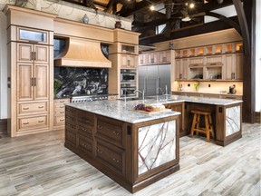 The maple cabinets and walnut island of this kitchen were distressed to tie in with the ceiling beams in this rural home. The project won Caroline Castrucci of Laurysen Kitchens second place for classic/traditional kitchen, price group D ($80,000+ without labour).