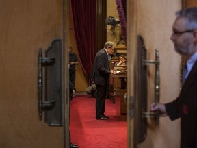 Separatist lawmaker Quim Torra, candidate for regional president, speaks at the platform during a parliamentary session in Barcelona, Spain, Saturday, May 12, 2018.