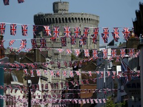 Union Jack flags fly across the main shopping street in Windsor, Tuesday, May 15, 2018. Preparations are being made in the town ahead of the wedding of Britain's Prince Harry and Meghan Markle that will take place in Windsor on Saturday May 19.