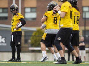 The newest addition to the CFL Hamilton Tiger Cats roster, quarterback Johnny Manziel (2) is seen with teammates on the field at McMaster University during Tiger Cats training camp in Hamilton, Ont., on Sunday, May 20, 2018. The former NFLer and Heisman Trophy winner signed a two-year deal with the Hamilton Tiger Cats to further his career after a long break calling the deal his "best opportunity for me moving forward."