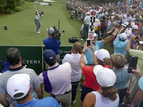 Tiger Woods tees off on the 10th hole during the third round of the The Players Championship golf tournament Saturday, May 12, 2018, in Ponte Vedra Beach, Fla.
