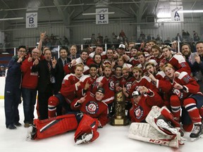 The Ottawa Jr. Senators celebrate with the Fred Page Cup after thrashing Longueuil 10-1 on Sunday. (NAVEED SHEIKH PHOTO)