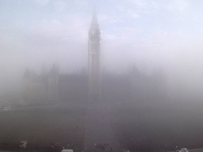 Parliament was draped in fog Tuesday morning.