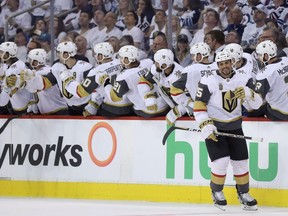 The Vegas Golden Knights celebrate after Ryan Reaves (75) scored during second period NHL Western Conference Finals game 5 hockey action against the Winnipeg Jets, in Winnipeg, Sunday, May 20, 2018.