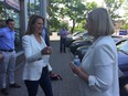 Caroline Mulroney, who’s running as the PC candidate in York-Simcoe, greets Ottawa South PC candidate Karin Howard at Howard’s campaign office Wednesday.