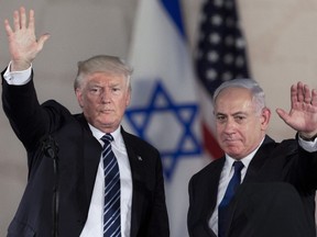 In this Tuesday, May 23, 2017 file photo, U.S. President Donald Trump, left, waves with Israeli Prime Minister Benjamin Netanyahu at the Israel Museum in Jerusalem.