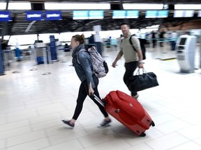 Passengers arrive at the departures terminal at the Ottawa International Airport on Monday, May 28, 2018.