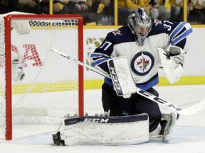 Winnipeg Jets goalie Connor Hellebuyck makes a stop against the Nashville Predators during the second period in Game 7.