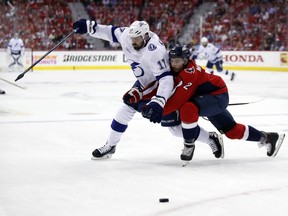 Tampa Bay Lightning left wing Alex Killorn (17) and Washington Capitals defenseman Matt Niskanen (2) collide during the first period of Game 3 of the NHL Eastern Conference finals hockey playoff series, Tuesday, May 15, 2018, in Washington.