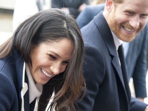 FILE - In this file photo dated Thursday March 8, 2018, Britain's Prince Harry and his fiancee Meghan Markle arrive for an event for young women, as part of International Women's Day in Birmingham, central England. Kensington Palace said Monday May 14, 2018, that Britain's Prince Harry and Meghan Markle are requesting "understanding and respect" for Markle's father after a celebrity news site reported he would not be coming to the royal wedding to walk his daughter down the aisle.