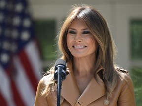 In this May 7, 2018 file photo, First lady Melania Trump speaks on her initiatives during an event in the Rose Garden of the White House in Washington. The White House says the first lady returned to the White House on Saturday, May 19.  She had been at Walter Reed National Military Medical Center near Washington since having an embolization procedure Monday for an unspecified kidney condition that the White House said was benign.