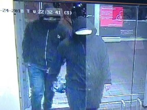 Police are now searching for two males caught on security camera, shown in this police handout image, who they say fled the scene immediately after an explosion at a restaurant in Mississauga. Fifteen people were injured Thursday night when an explosion police say was caused by an "improvised explosive device" ripped through a restaurant in Mississauga. Ontario.