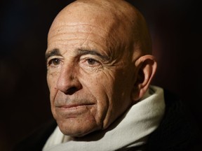 FILE - In this Jan. 10, 2017 file photo, Tom Barrack, chairman of the inaugural committee, speaks with reporters in the lobby of Trump Tower in New York. The Associated Press has learned that investigators working with special counsel Robert Mueller have interviewed Barrack. Two people familiar with the probe tell the AP that Barrack met with federal investigators working on the Russia inquiry. The people spoke on condition of anonymity to discuss private deliberations. Barrack spokesman Owen Blicksilver declined comment.