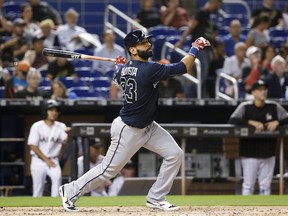 FILE - In this May 10, 2018, file photo, Atlanta Braves' Jose Bautista bats during the fourth inning of a baseball game against the Miami Marlins in Miami. The Braves have released Bautista a month after picking up the veteran slugger and will make Johan Camargo their starting third baseman.