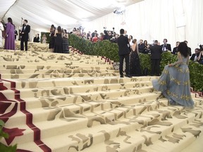 Media appear on the carpet before The Metropolitan Museum of Art's Costume Institute benefit gala celebrating the opening of the Heavenly Bodies: Fashion and the Catholic Imagination exhibition on Monday, May 7, 2018, in New York.