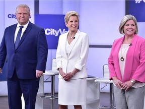 Ontario Progressive Conservative Leader Doug Ford, left, Liberal Leader Kathleen Wynne, centre, and NDP Leader Andrea Horwath take part in the Ontario Leaders debate in Toronto on Monday. This is the first of three debates scheduled.