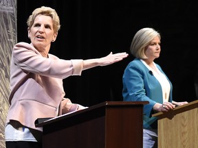 Ontario Liberal Leader Kathleen Wynne, left, and Ontario NDP Leader Andrea Horwath take part in the second of three leaders' debate in Parry Sound, Ont., on Friday, May 11, 2018.