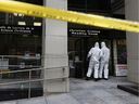 File photo: Police tape in front of 141c Laurier Ave in Ottawa Friday May 25, 2018. A woman was found bloodied and beaten inside the office at the Christian Science Reading Room at 141c Laurier Ave. West. 